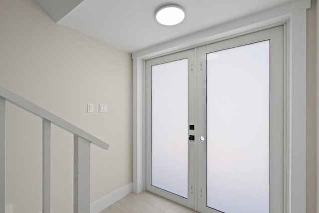 entryway featuring french doors