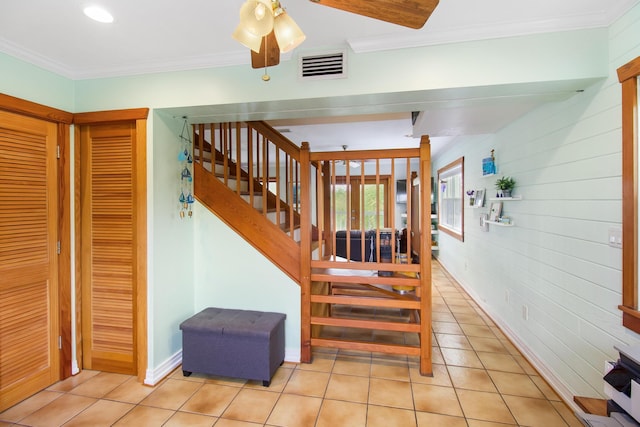 25057 7th St, Summerland, FL 33042 - staircase with tile patterned floors and crown molding