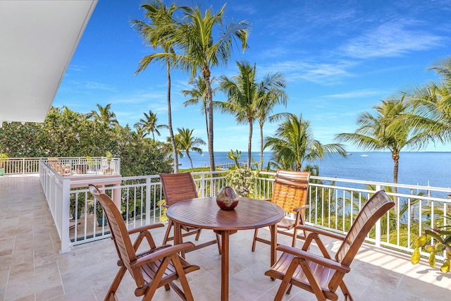 balcony featuring a water view