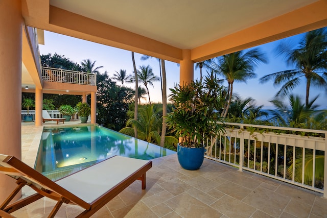 outdoor pool featuring a patio