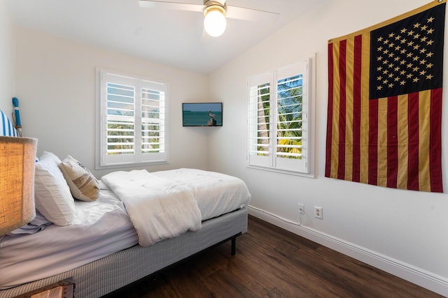 bedroom with ceiling fan and dark hardwood / wood-style flooring