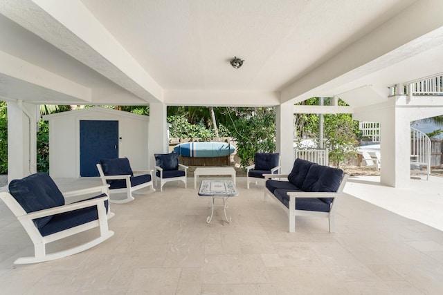 view of patio featuring an outdoor hangout area and a shed