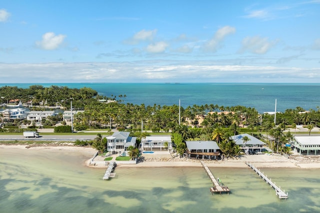 aerial view featuring a water view and a beach view