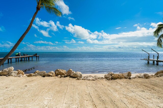 water view with a boat dock and a beach view