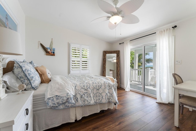 bedroom with multiple windows, dark wood-type flooring, access to exterior, and ceiling fan