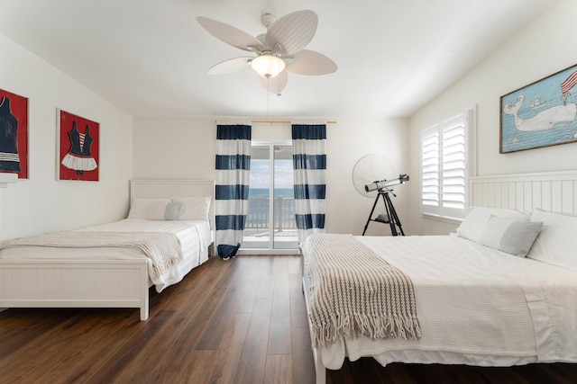 bedroom featuring dark hardwood / wood-style flooring, access to exterior, and ceiling fan