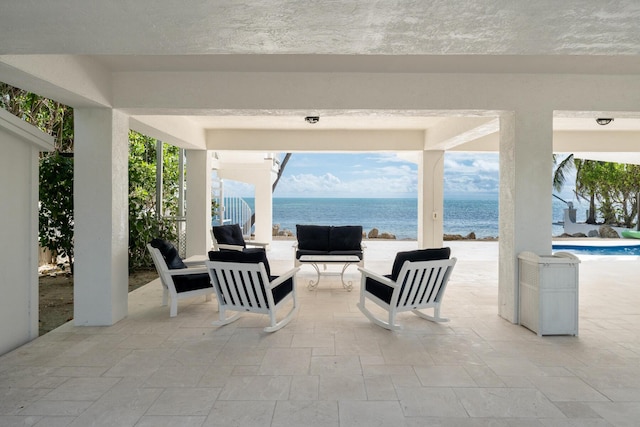 view of patio featuring a water view