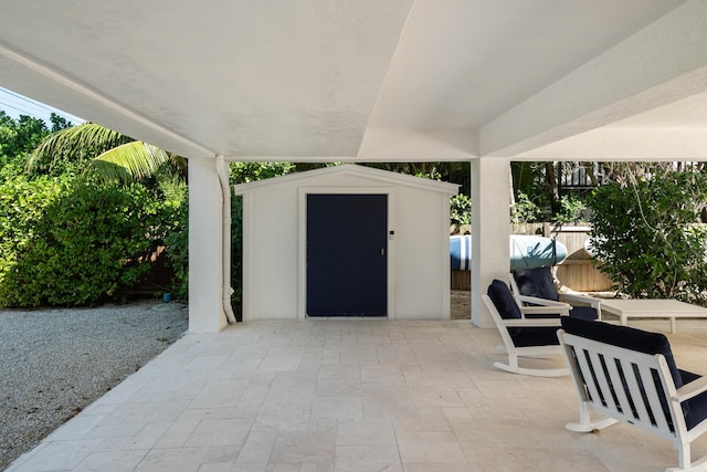 view of patio featuring a storage unit