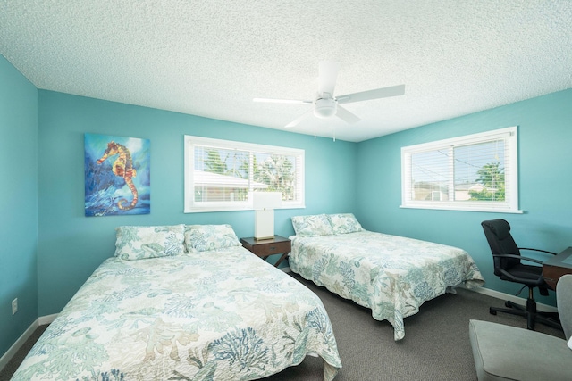22738 Blackbeard Ln, Cudjoe, FL 33042 - carpeted bedroom featuring baseboards, ceiling fan, and a textured ceiling