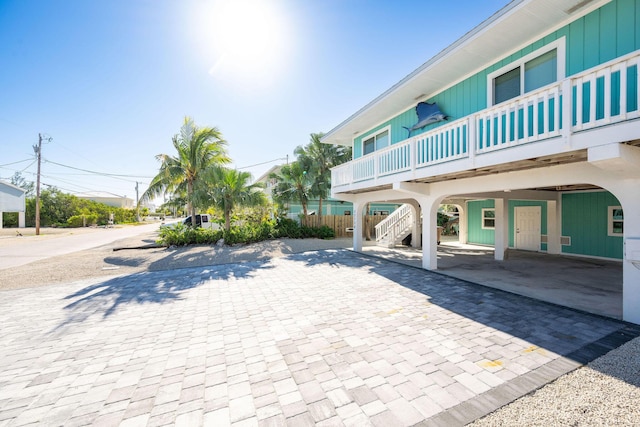 22738 Blackbeard Ln, Cudjoe, FL 33042 - view of community featuring a carport and stairway