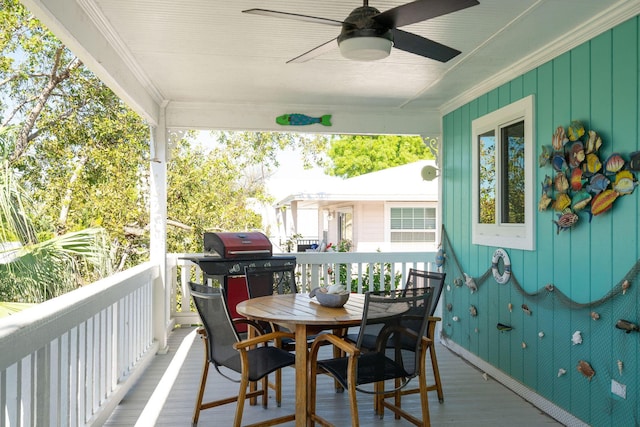 22738 Blackbeard Ln, Cudjoe, FL 33042 - deck with a ceiling fan, grilling area, and outdoor dining area