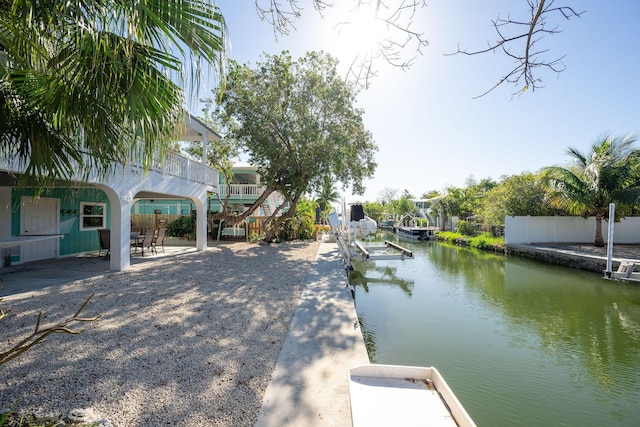 22738 Blackbeard Ln, Cudjoe, FL 33042 - dock area with a water view and a patio