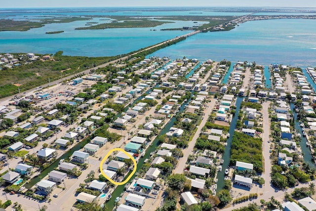 22738 Blackbeard Ln, Cudjoe, FL 33042 - aerial overview of property's location featuring a large body of water, a notable bridge, and nearby suburban area
