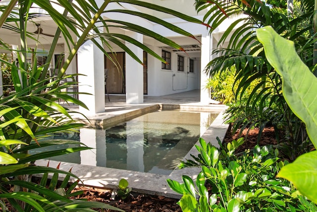 doorway to property with a patio area