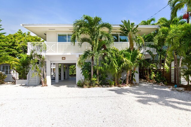 raised beach house with a carport