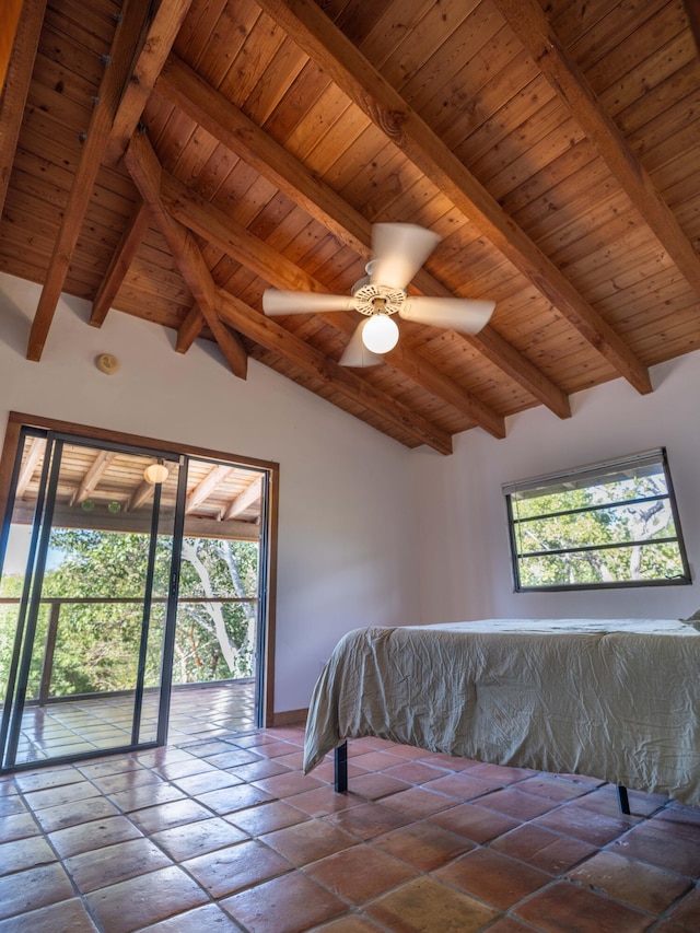 unfurnished bedroom featuring ceiling fan, access to exterior, lofted ceiling with beams, and wooden ceiling