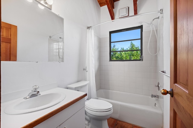 full bathroom with shower / tub combo with curtain, vanity, and toilet