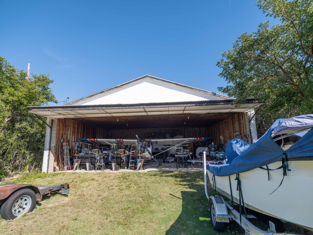 view of outdoor structure featuring a lawn