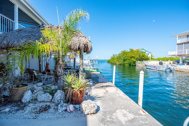 property view of water featuring a boat dock