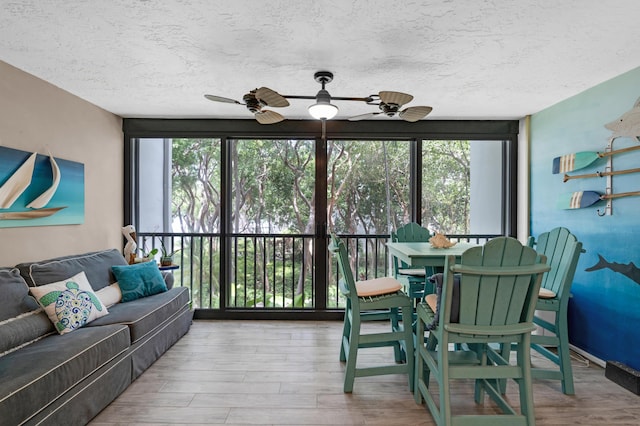 interior space featuring hardwood / wood-style floors, a textured ceiling, and ceiling fan