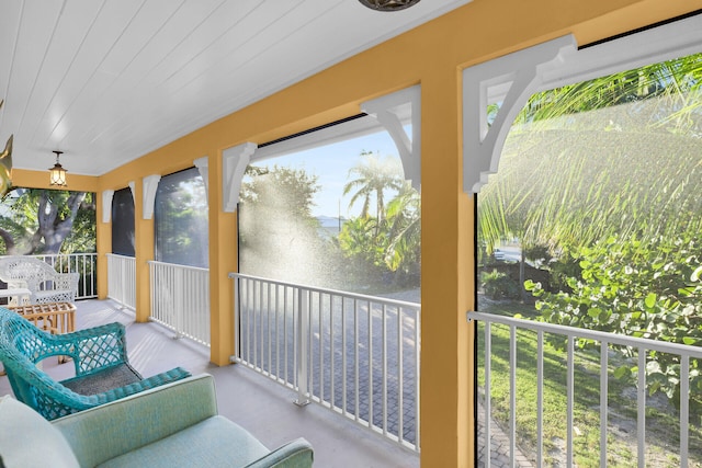 sunroom / solarium with wood ceiling