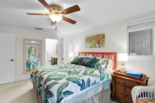 carpeted bedroom with connected bathroom, ornamental molding, and ceiling fan