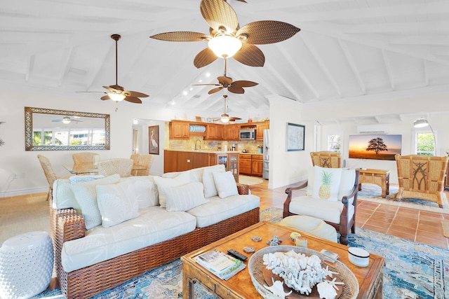 living room featuring an AC wall unit, sink, and vaulted ceiling with beams