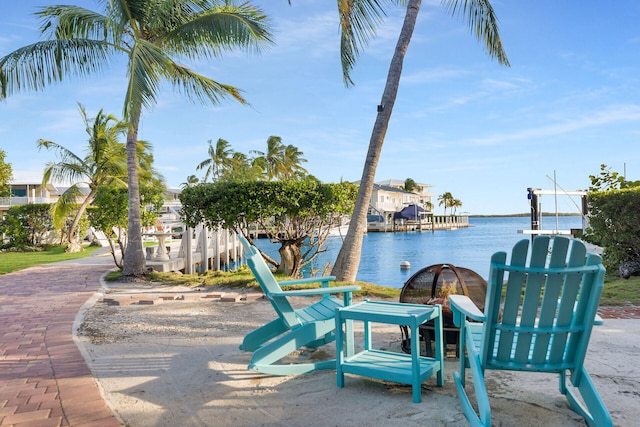 view of patio with a water view