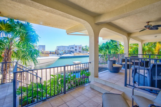 view of patio with a fenced in pool and ceiling fan