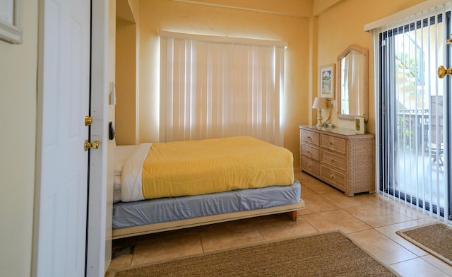 bedroom featuring light tile patterned floors