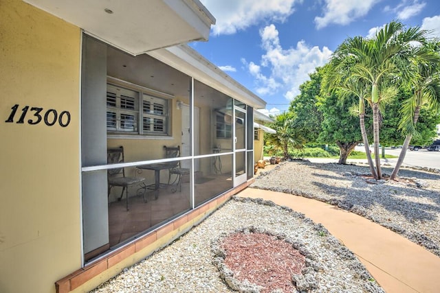 exterior space with a sunroom