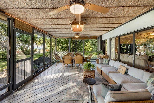 sunroom / solarium with wooden ceiling and ceiling fan