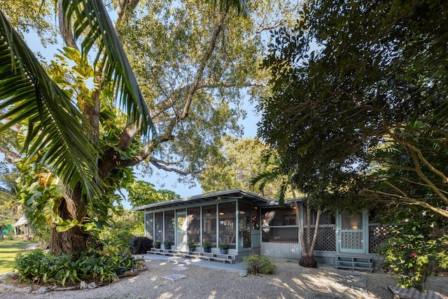 view of front of home featuring a sunroom