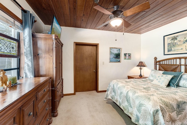 bedroom featuring light colored carpet, wooden ceiling, multiple windows, and baseboards