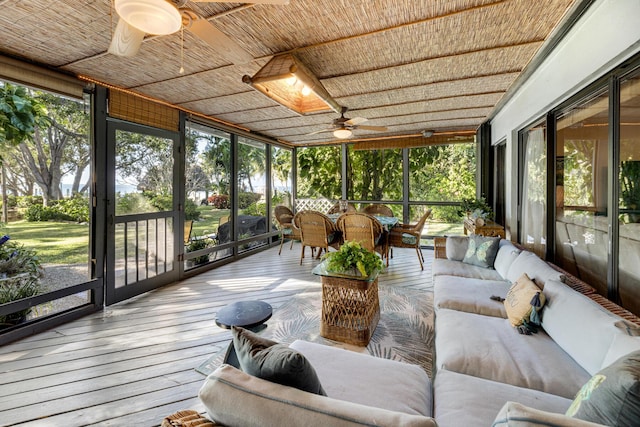 sunroom / solarium featuring wood ceiling and ceiling fan