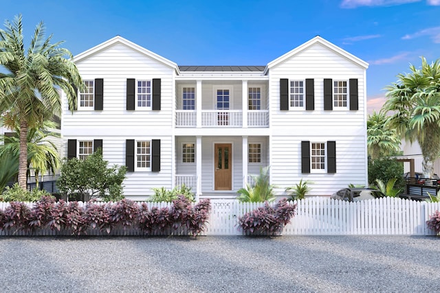 1314 Johnson St, Key West, FL 33040 - view of front of property featuring a balcony, a fenced front yard, covered porch, a metal roof, and a standing seam roof