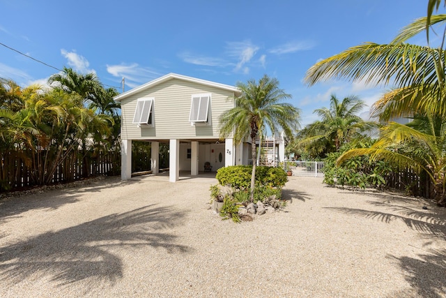 view of front of property featuring a carport