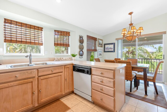 kitchen with dishwashing machine, sink, pendant lighting, kitchen peninsula, and a chandelier