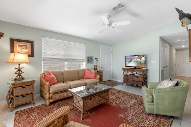 tiled living room featuring lofted ceiling and ceiling fan