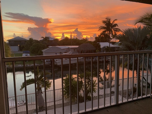 balcony at dusk with a water view