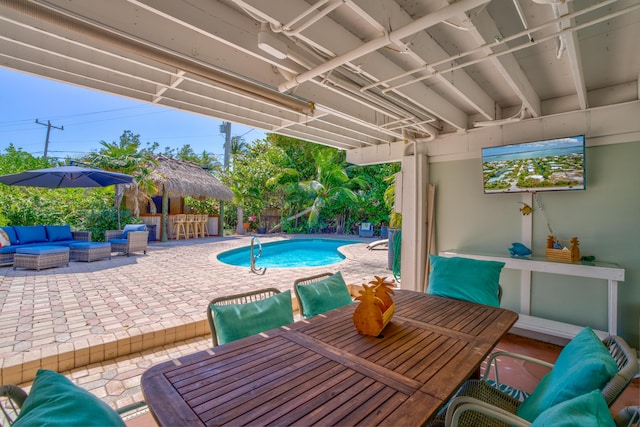 view of patio featuring a fenced in pool, an outdoor hangout area, and outdoor dining area