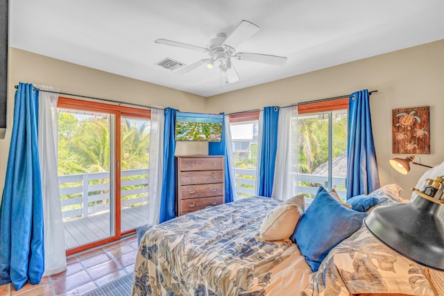 bedroom featuring access to outside, visible vents, and ceiling fan