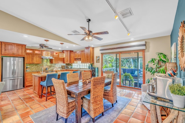 dining area with vaulted ceiling, light tile patterned floors, recessed lighting, and visible vents