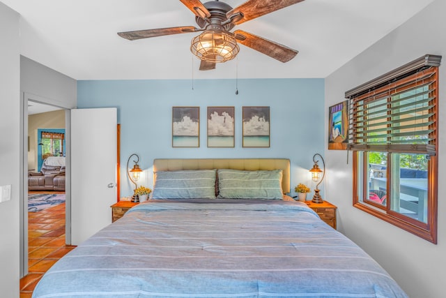 bedroom featuring tile patterned floors and a ceiling fan