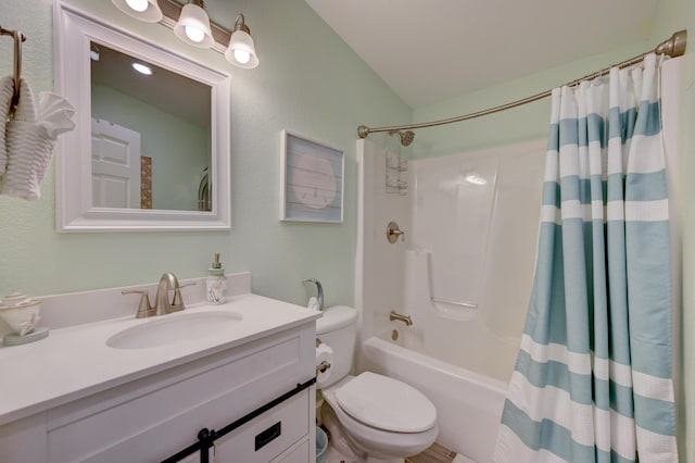 full bathroom featuring vanity, shower / bath combination with curtain, and toilet