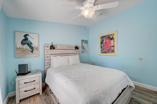 bedroom featuring ceiling fan and hardwood / wood-style floors