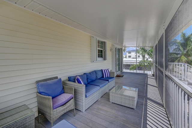 wooden terrace featuring outdoor lounge area