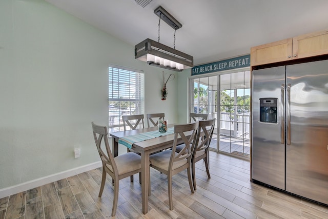 dining room featuring light hardwood / wood-style floors