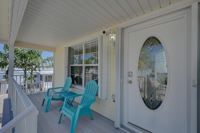 doorway to property with covered porch