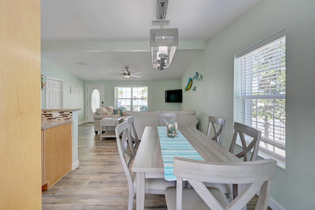 dining room featuring light hardwood / wood-style floors and ceiling fan